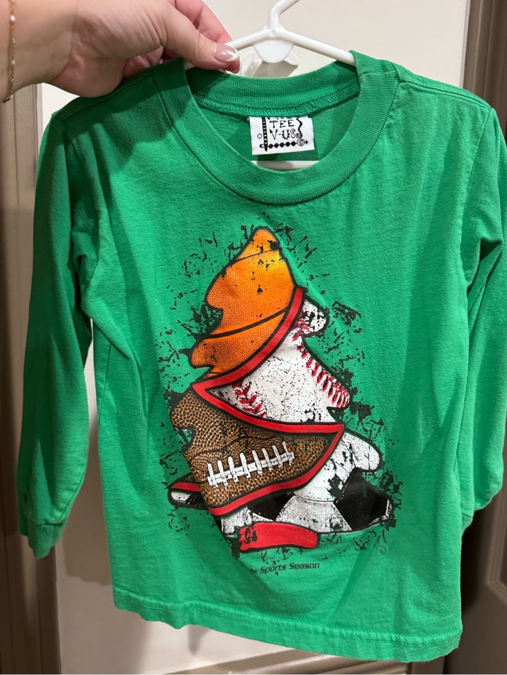 Christmas Green Long Sleeve Tee with Colorful Sports Stack Graphic